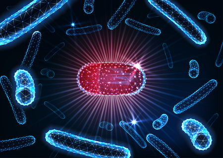 Antibiotics pills in bacteria medium concept. Futuristic drug capsule among bacilli microorganisms.
